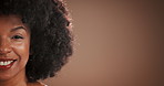 Face, black woman and skincare with smile in studio for natural glow, cosmetics and facial treatment. Mockup, person and beauty for dermatology results, afro and self care shine on brown background