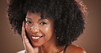 Face, skincare and woman with afro, confident and smile for growth of hair, cosmetics and treatment. Brown background, black person and happy for haircare, studio and glow of hairstyle or texture