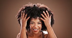 Afro, beauty and hair with face of black woman in studio for natural textures, self care and cosmetics. Volume, shampoo and growth with person on background for cosmetology and salon transformation