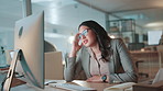 Business woman, computer and tired in office at night for publication deadline, brain fog or fatigue. Media agency, journalist and exhausted with proofreading article, editor feedback and overworked