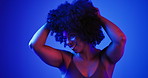 Smile, black woman and neon with hair care in studio for volume, natural afro and healthy growth. Happy, female person and cosmetics for curly textures, keratin treatment and shine for transformation