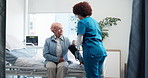 Nurse, old woman and blood pressure test in hospital for healthcare checkup, hypertension and exam. Assessment, expert and monitor heart wellness of elderly patient for cardiovascular health on bed