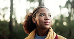 Hiking, explore and woman with walking in forest for travel adventure, sightseeing and wellness. Trekking, scenery and african person with journey for fresh air, hobby and holiday trip in countryside