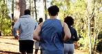 Fitness, people and group running in forest for marathon practice, endurance and tracking pace. Cardio club, back and jog together in woods for competition, exercise and check watch for performance