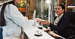 Hotel, receptionist and guests with passport for check in, reservation and concierge service. Hospitality industry, employee and people with arrival for accommodation, holiday booking or confirmation