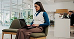 Hotel, laptop and business woman typing email, hospitality management and update booking system. Lobby, computer and serious worker on internet to check motel review, schedule and change room price