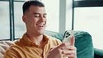 Happy, sofa and man with phone laughing for social media, funny message and chatting. Living room, home and person on smartphone for communication, internet humor and online meme on mobile app