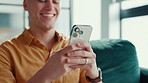 Happy, sofa and man with phone in home for social media, reading message and chatting. Living room, laugh and person on smartphone for communication, internet joke and online meme on mobile app