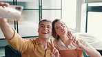 Selfie, happy and couple on sofa in home with peace sign, bonding or relaxing together in living room. Smile, connection and man with woman for photography picture for relationship memory in house.