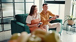 Playing, games and fun for couple with controller, home and cheating for next level, love or online. Laughing, man and woman with console for virtual sport, entertainment and happy for challenge