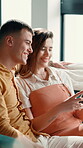 Home, couple and smile with tablet for streaming, online message and selection for movie in lounge. Sofa, man and woman with digital for application, social media or film website for bonding with hug