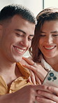 Home, couple and smile with smartphone for chat, online message and reel for laughing in lounge. Sofa, man and woman with mobile for application, social media and funny comment for bonding together