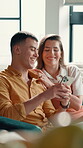 Home, couple and laughing with smartphone for chat, online message and smile for reel in lounge. Sofa, man and woman with mobile for application, social media and funny comment for bonding together