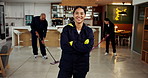Janitor, woman and arms crossed with face, hygiene service and wet floor for disinfection. Portrait, safety and manager for sanitation group, maintenance worker and tile polishing for wellness
