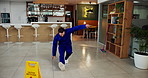 Janitor, accident and man fall in office with workplace safety, ignore warning sign and negligence. Danger, hazard and cleaner slipping on wet floor for workers compensation, mistake and legal claim