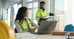 Civil engineer, architecture and people with laptop, pointing or collaboration for building project. Colleagues, woman and man with tech for design, architect and discussion for layout in office