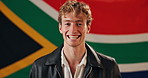 Man, face and excited with South Africa flag in studio for national pride, confident and patriot by background. Person, model and happy in portrait with symbol, support or sign for loyalty to country