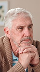 Home, thinking and old man with nostalgia, sad and mental health with retirement. Pensioner, apartment and elderly person with history, depression and alzheimer with memory, thoughts and decision
