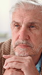 Home, thinking and old man with nostalgia, memory and mental health with reflection. Pensioner, retirement and senior person with history, depression and alzheimer with thoughts, sad and remember