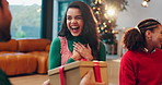 Surprise, woman and friends with gift for Christmas event, thank you and festive celebration. Smile, people and listening to present, show gratitude and bonding together of holiday tradition at house