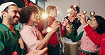 Christmas, sparkler and party with friends in home for celebration, social reunion and festive. Merry xmas, cheers and dance with group of people in living room for holiday season, support and event