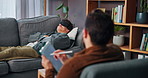 Man, relax and consultation with psychologist for therapy or hypnotherapy with tablet in office. Counselor, notes and help patient on sofa with eye mask for insomnia, sleep paralysis or mental health