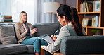 Woman, counseling and therapist writing notes for mental health, support or listen for advice. Clipboard, psychologist and talking with patient for therapy, depression and help with anxiety in office