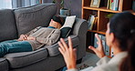 Woman, relax and consulting psychologist for hypnotherapy or stress relief in office. Counselor, peace and help patient on sofa for calm with eye mask for insomnia, sleep paralysis and mental health