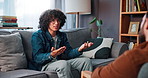 Counseling, talking and student on sofa with therapist for help, support and advice for college stress. Mental health, therapy and guidance counsellor with man for exam anxiety, burnout and failure