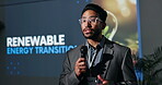 Renewable energy, speaker or man in seminar speech for ecology, awareness or forum. Presentation, event or keynote guest on stage in summit discussion for sustainability or eco friendly convention