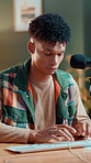 Typing, editor and streamer with man in studio for research, content creation and file import. Creative project, social platform review and person in home for online thumbnail and podcast program