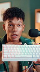 Keyboard, influencer and review with man in studio for gaming pad, ergonomic and live streaming. Product feedback, tech guide and content creator with person in home for recording and promotion
