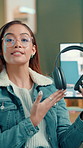 Live streaming, face and woman with headphones for review, sound quality or design. Content creator, talk or show tech for product sponsorship, promo or advertising with audiophile with pov at home