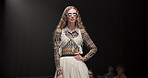 Fashion show, pose and stage or woman on runway for luxury collection, designer clothes and event. Wardrobe showcase, aesthetic and catwalk with person or model for style, industry and trends