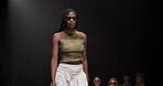 Fashion, luxury and runway with woman at event for designer collection, clothing showcase and couture. Fabric, wardrobe and catwalk show with model walking on stage for trendy, and style industry