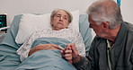 Holding hands, hospital bed and senior couple for comfort, support and empathy for recovery. Healthcare, marriage and mature man and woman with affection for compassion, care and help for wellness