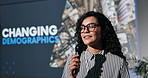 Microphone, presentation and businesswoman at seminar with speech for changing demographics. Conference, screen and female research analyst with workshop for target market training at convention.