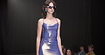 Fashion show, walking and stage or woman on runway for luxury collection, designer clothes and event. Wardrobe showcase, aesthetic and catwalk with person or model for style, industry and trends