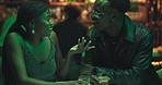 Happy, couple and talk with alcohol at nightclub for discussion, nightlife and date at party event. People, laughing and drinks, funny chat and bonding together for clubbing hangout for happy hour 