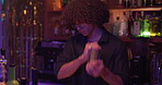 Bartender, drink and man mixing at a pub for job, martini or happy hour at counter. Person, mixologist and barman with alcohol beverage at bar or nightclub for drinking, social event and party