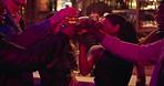 Happy people, night club and cheers with drink for party, celebration or toast together. Excited, group or friends with smile, alcohol or energy in late evening for good vibes, event or dance at bar