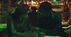 Smile, couple and talk with alcohol at nightclub for discussion, nightlife and date at party event. People, laughing and drinks, funny chat and bonding together for clubbing hangout for happy hour 