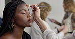 Woman, model and beautician for fashion, makeup or photoshoot interview in studio. Behind the scenes, stylist and artist touch up in media agency with designer, cosmetology and creative industry
