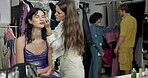 Makeup artist, backstage and eyeliner with women in studio for cosmetics, fashion and makeover. Stylist, beautician and behind the scenes with people for dressing room, model touch up and talent