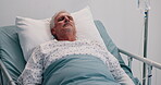 Senior man, sleeping and bed in hospital for post surgery, recovery and tired from anesthesia. Elderly patient, asleep and iv drip of healthcare services, wellness and treatment from operation in ICU