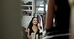 Woman, makeup artist and backstage for foundation application or prepare with brush. Behind the scenes, cosmetics or model with stylist for touch up, fashion photoshoot and smile in production studio