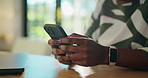 Hands, phone and texting by laptop with remote work from home with contact, networking and chat. Person, smartphone and typing on mobile app, notification and freelance copywriting on social media
