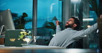 Night, tired and man with computer, stretching and fatigue with proofreading for article. Evening, exhausted and journalist in office, pc and editor with burnout, yawning and research for proposal