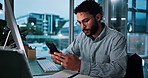 Business, man and typing with phone in office for accounting, check notification and evening. Person, computer and mobile for schedule update, search internet and chat online for proposal feedback