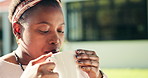 Coffee, relax and black woman outdoor in morning for mindfulness, calm and peace at house. Cappuccino, ideas and African female person thinking, memory or drinking caffeine latte in home garden.